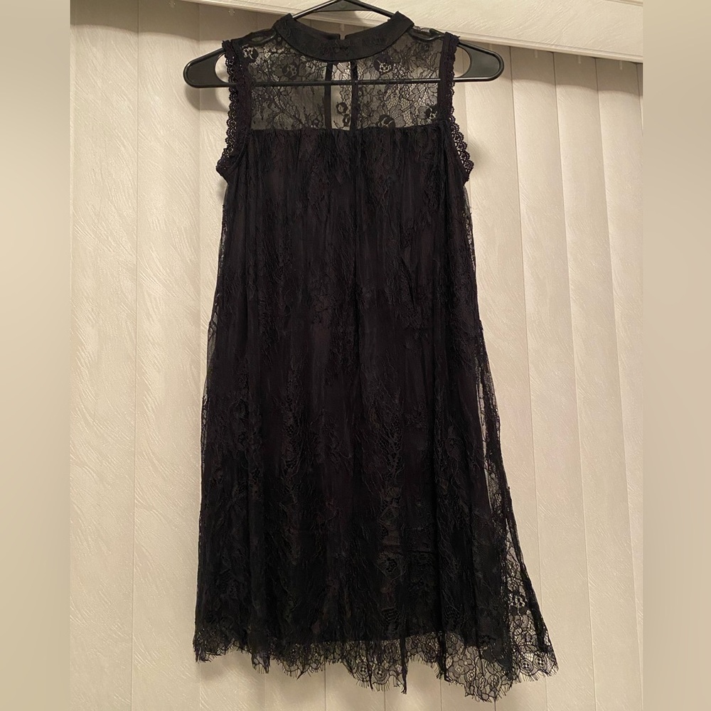 Black lacy dress (hits above the knee). Size: XS.